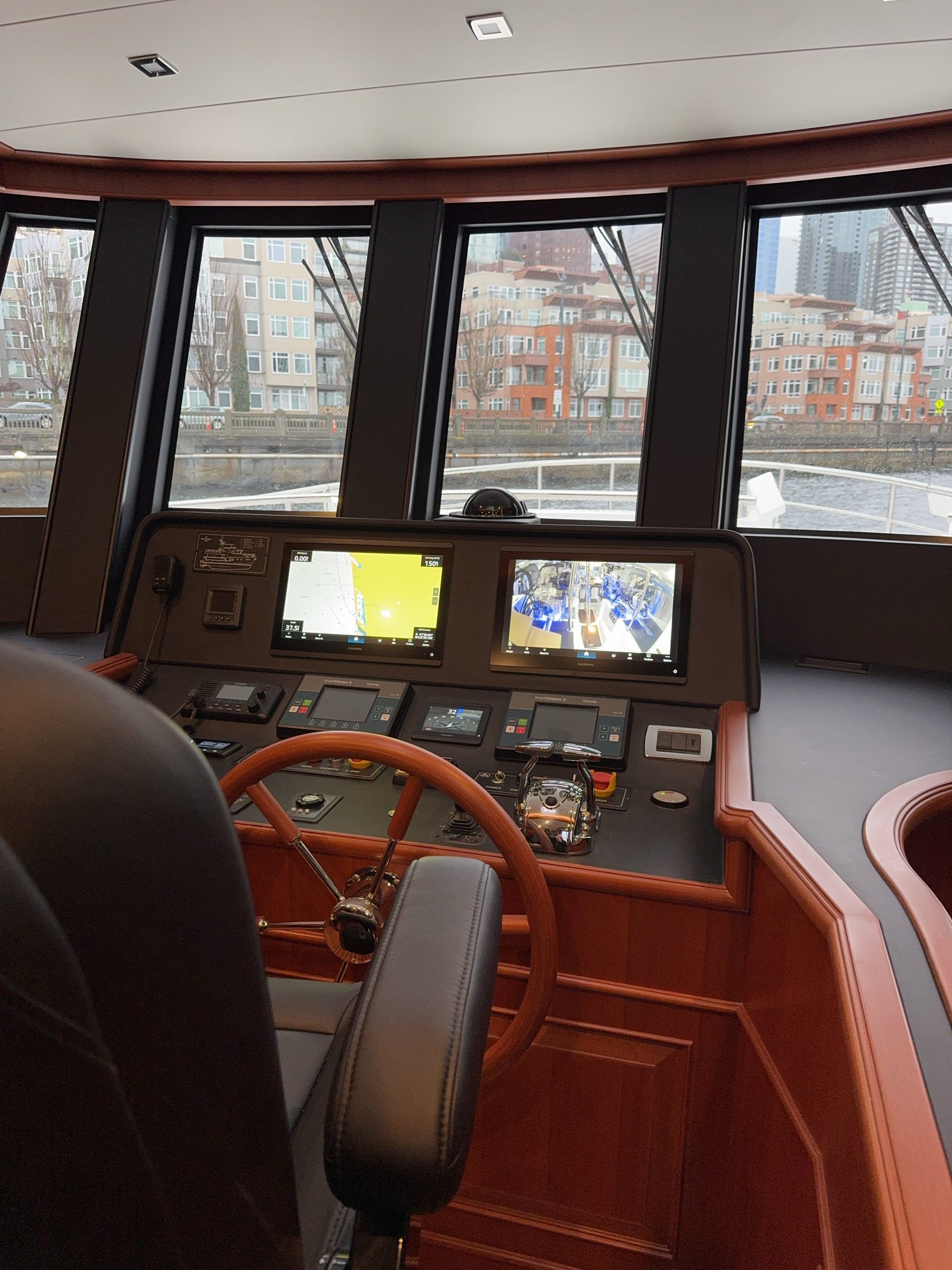 Pilothouse and helm navigation station in Northwest 55 expedition, trawler-style yacht.