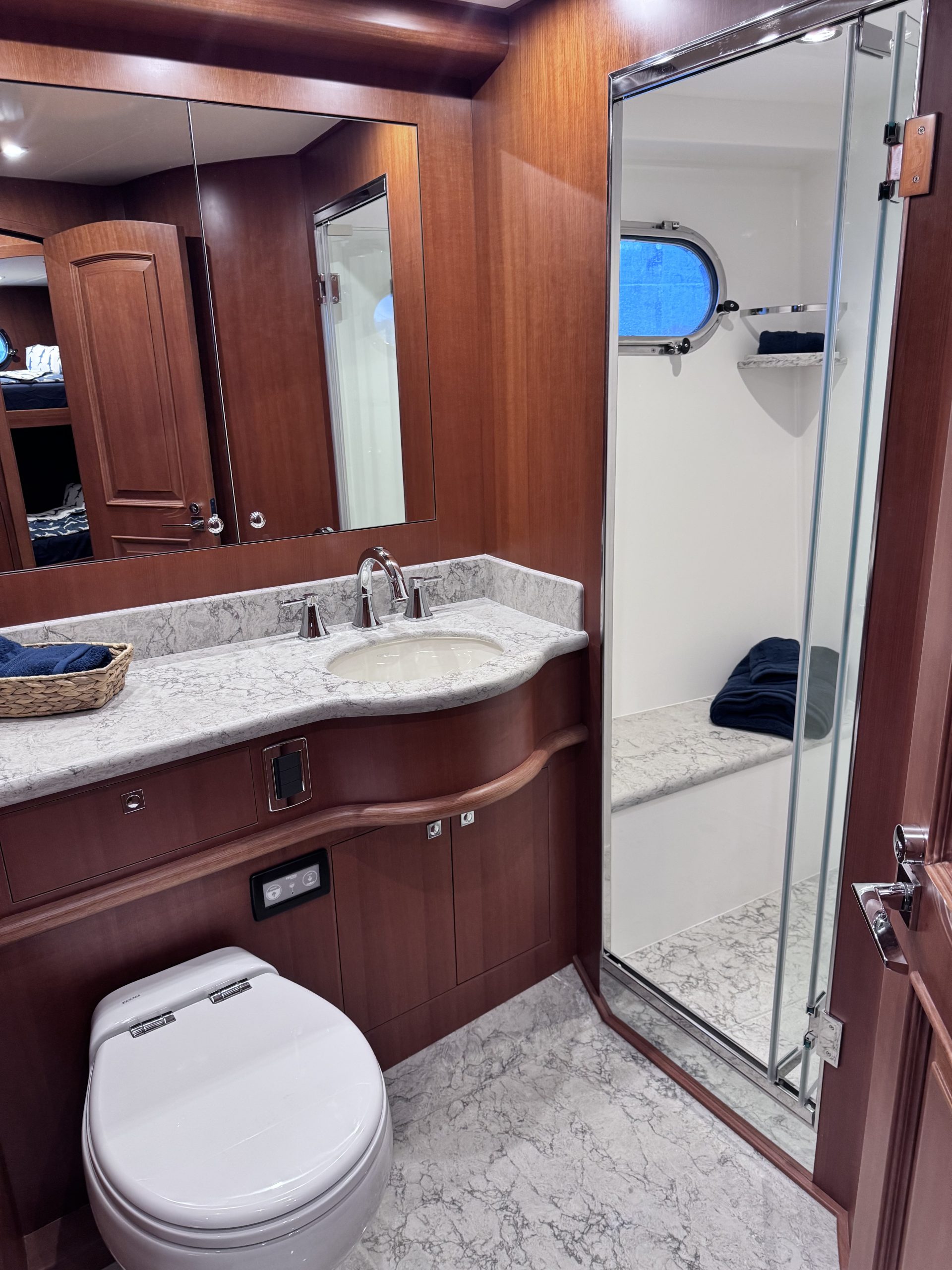 Guest Head with toilet, vanity and shower in Northwest 55 expedition yacht.