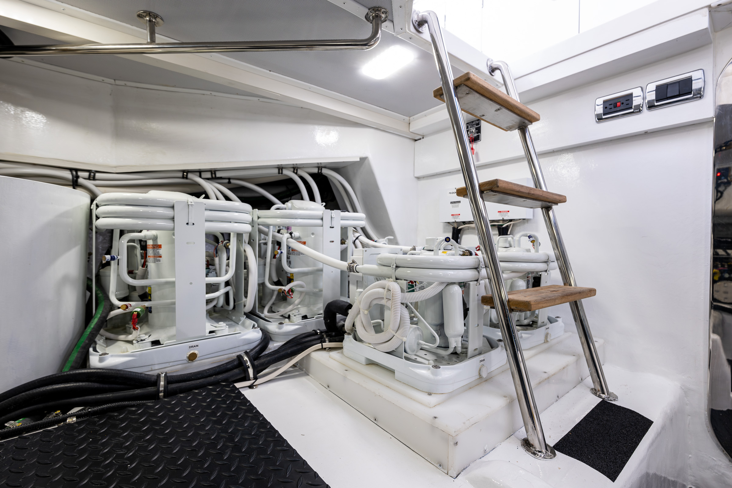 Access stairs to engine room onboard the Northwest 55 expedition trawler yacht.