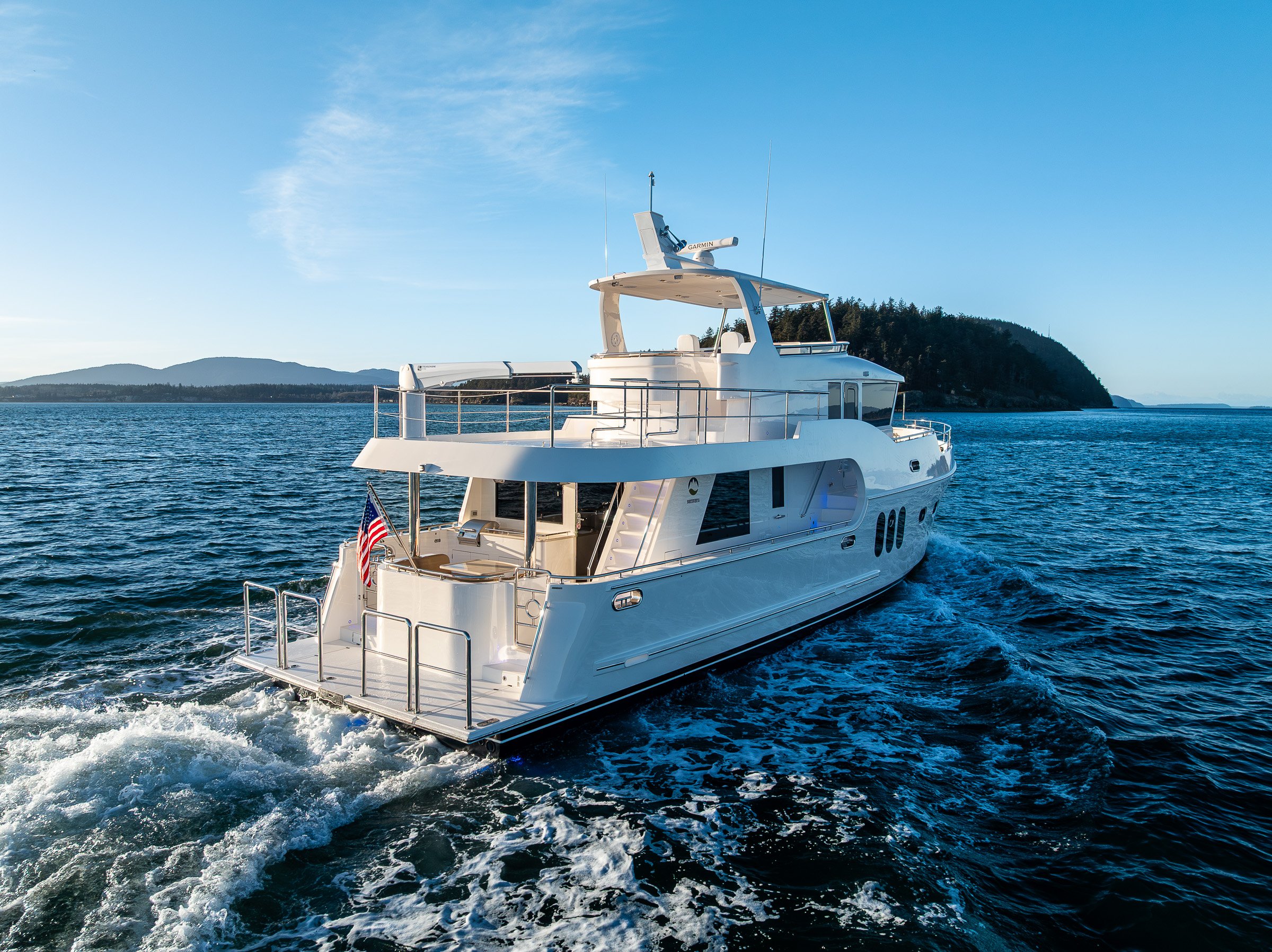 Stern view of Northwest 55 expedition yacht cruising on the Salish Sea