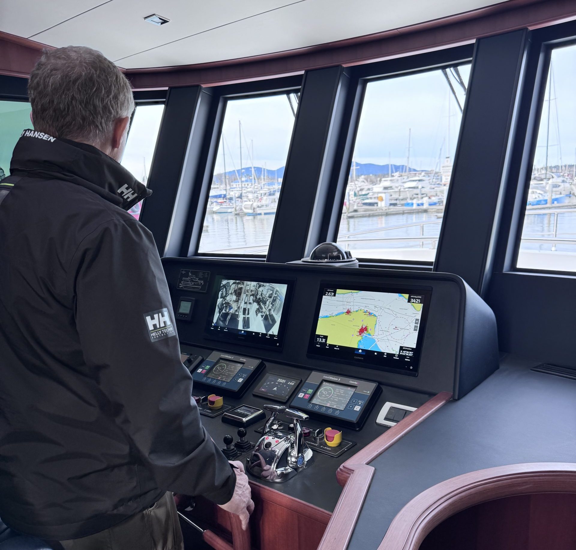 Seattle Yachts broker and Northwest Yachts brand Manager Martin Snider at helm of Northwest 55, training new captain and skipper.
